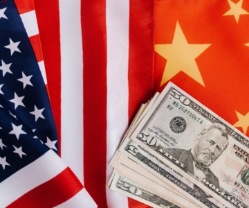 american and chinese flags and usa dollars